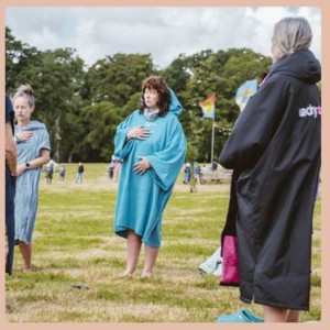 people in dry robes meditating standing up